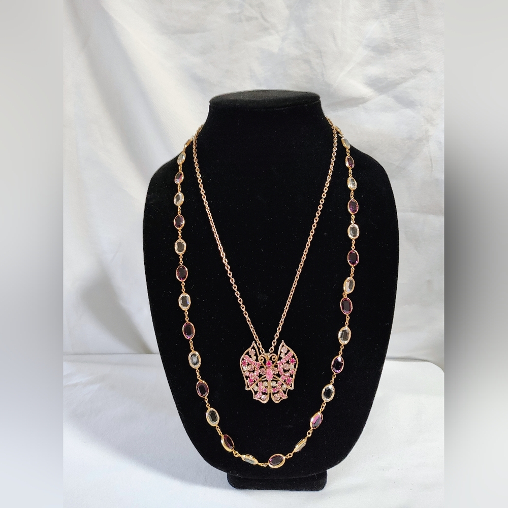Gold and Pink Butterfly Necklace Layered With A Clear And Purple Stones Necklace
